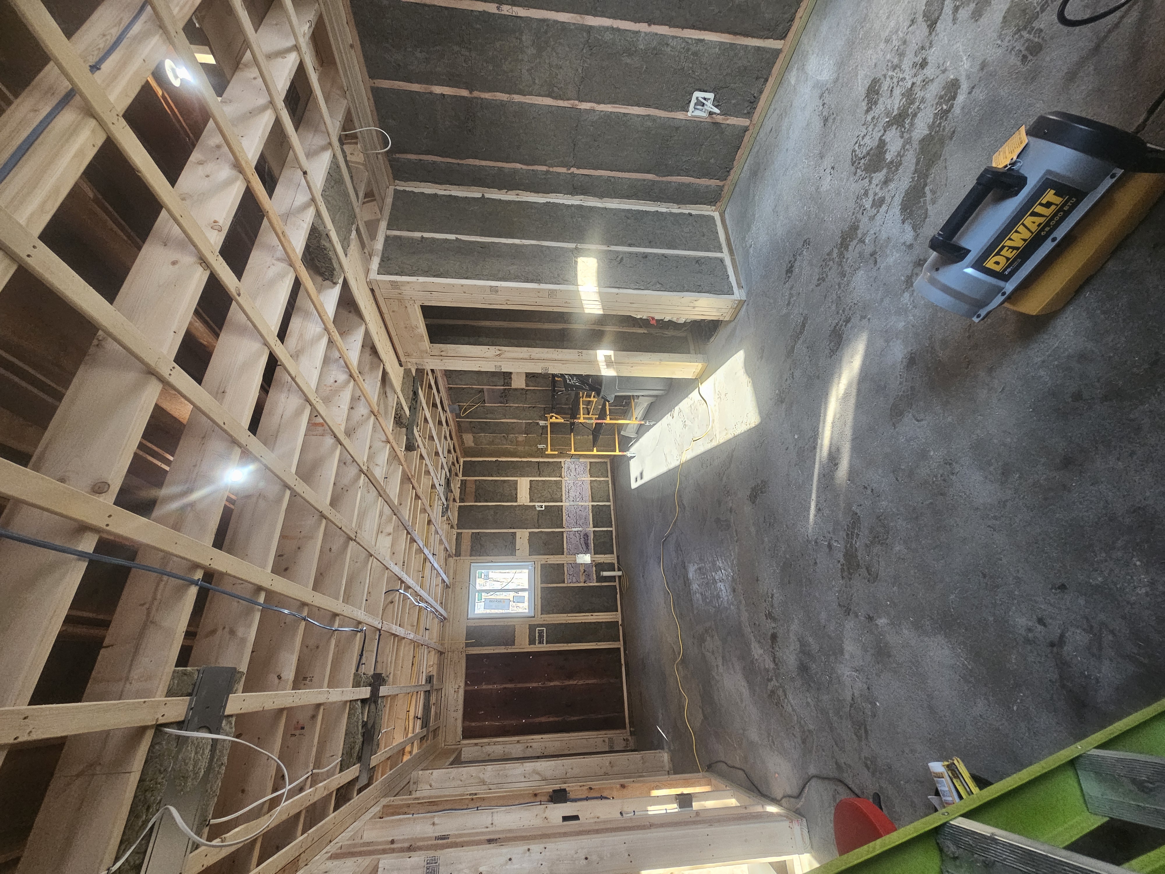 In law addition at framing stage showing lviing room and kitchen area in Merrimack NH