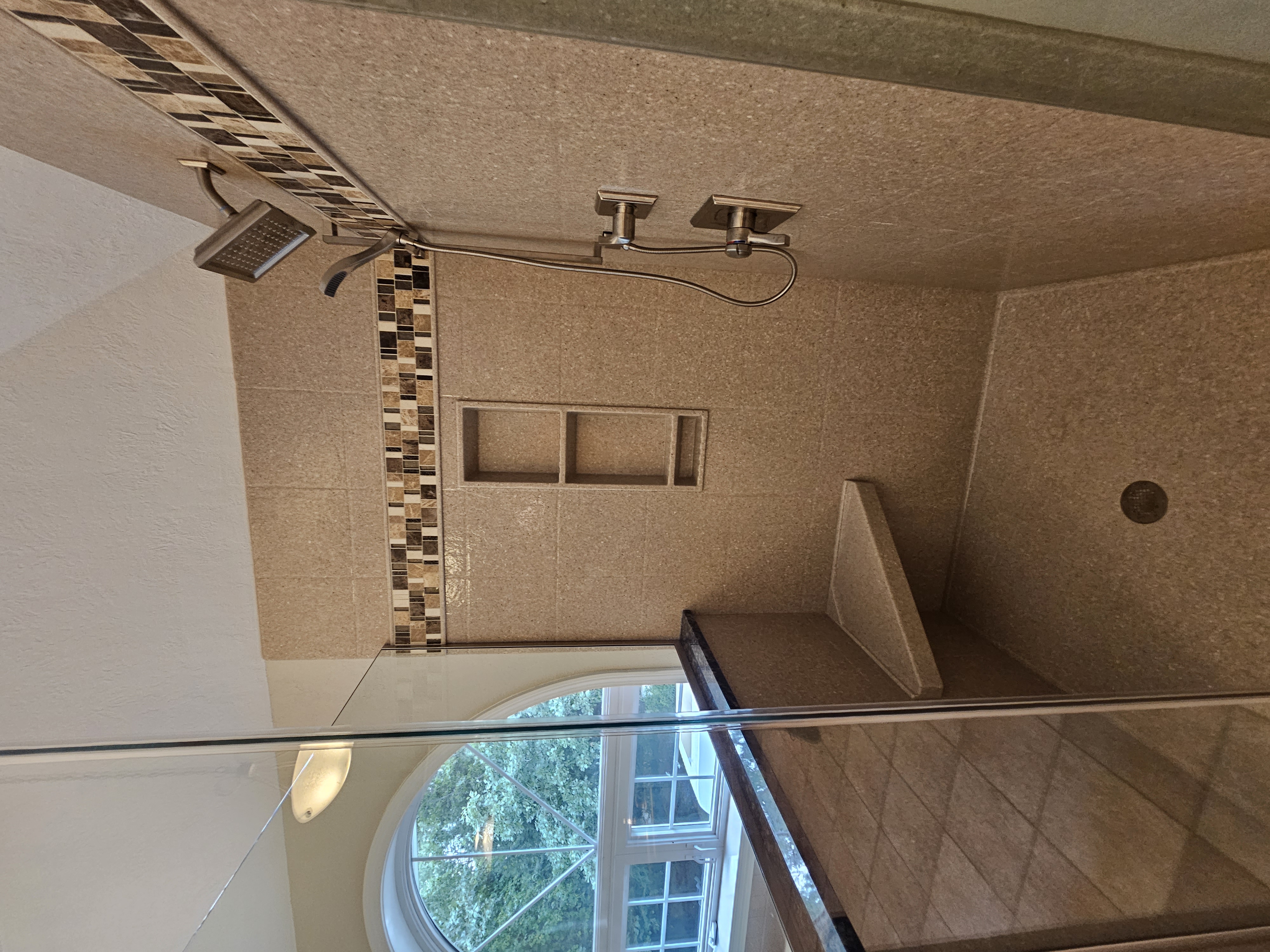 Custom corner shower replacement featuring solid corian shower walls