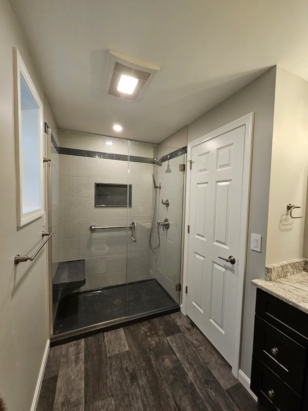 Contemporary bathroom with custom vanity and modern tile work