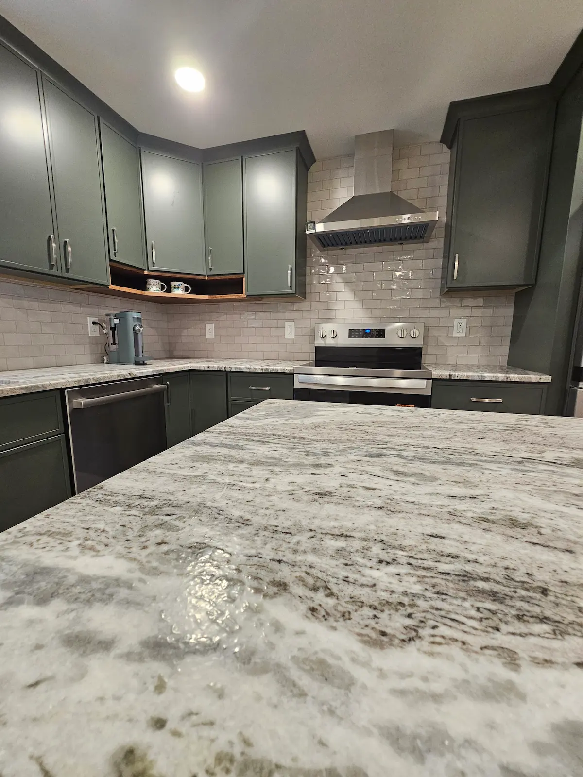 Modern kitchen remodel with custom cabinets and granite countertops