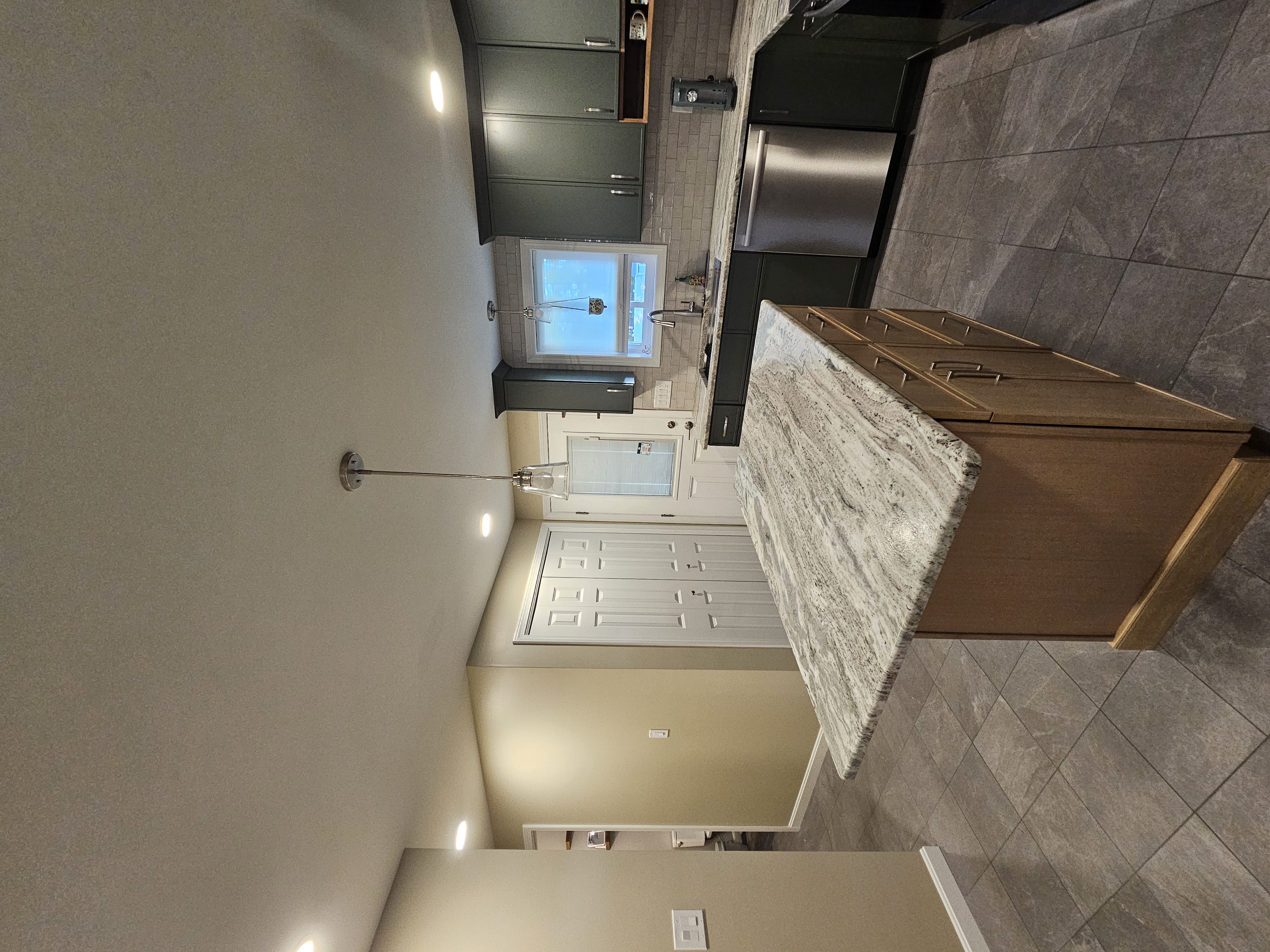 Contemporary kitchen renovation with modern appliances and finishes