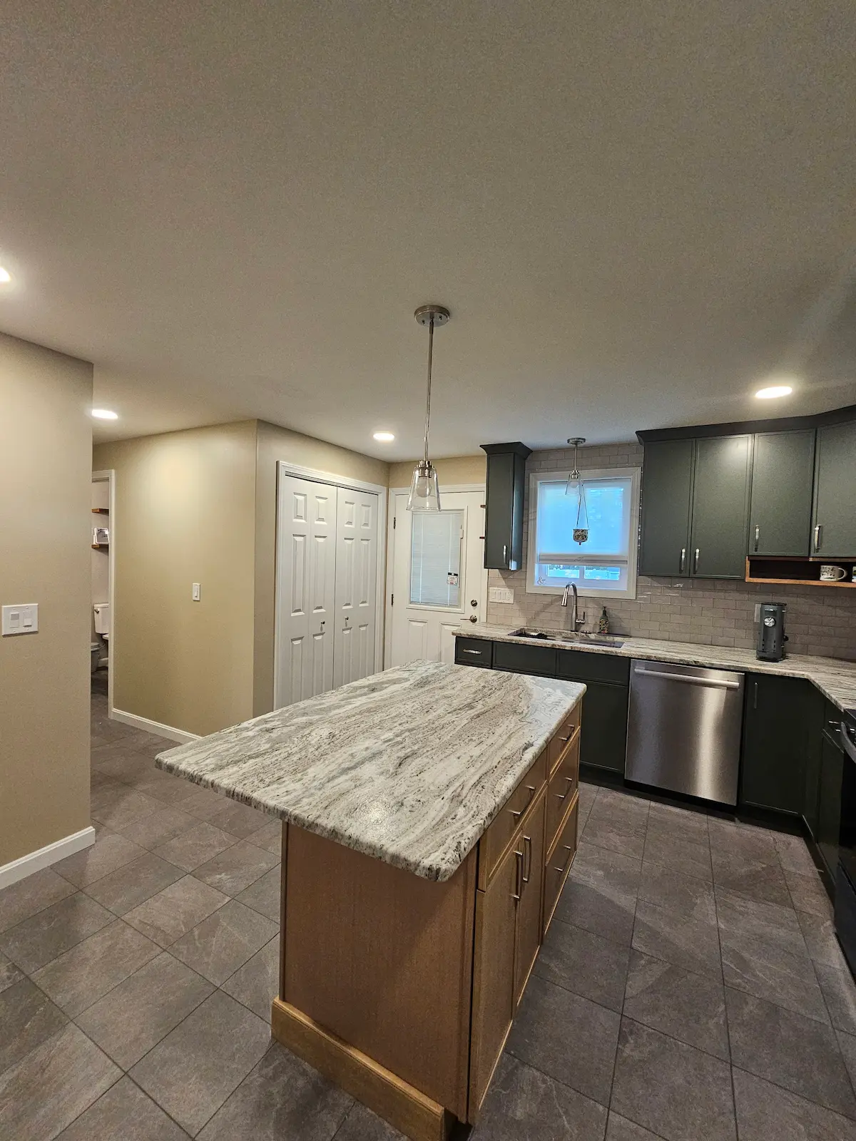 Contemporary kitchen renovation with modern appliances and finishes
